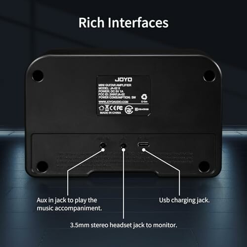 Back view of Joyo mini guitar amplifier showing interfaces.